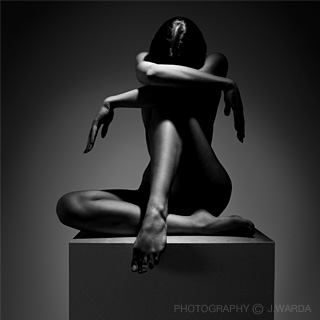 nude female model posing on cube B&W photo by j.warda the naked pixel fine art nude photography berlin